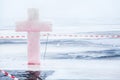 Ice cross and hole in winter pond on Epiphany Royalty Free Stock Photo