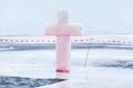 Ice cross and hole in winter pond on Epiphany Royalty Free Stock Photo