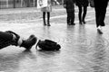 Ice crusted ground, slipped girl lying on sidewalk