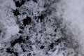 Ice crystals on a dark background, close-up. Ice texture background Royalty Free Stock Photo