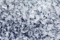 Ice crystals of frozen water on a dark surface Royalty Free Stock Photo