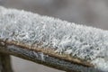 Ice crystals on an old wooden crossbar