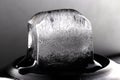 Ice cube on black background. Low key photo Royalty Free Stock Photo