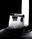 Ice cube on black background. Low key photo Royalty Free Stock Photo