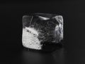Ice cube on black background. Low key photo Royalty Free Stock Photo