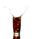 Ice cube droped in cola glass Royalty Free Stock Photo