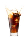 Ice cube droped in cola glass Royalty Free Stock Photo