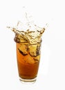 Ice cube droped in cola glass Royalty Free Stock Photo