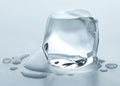 Ice cube. Melting Ice cubes with water drops on a table. Clear ice in cube shape. Frozen water. Ice maker for freeze water