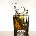 Ice cube splash in whisky Royalty Free Stock Photo
