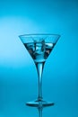 Ice cube splashing martini cocktail Royalty Free Stock Photo