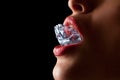 Ice cube in woman's mouth. Royalty Free Stock Photo