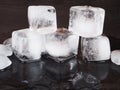 Ice cubes on black table background with water drops Royalty Free Stock Photo