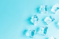 Ice cubes on blue background, Cubes of ice on a light blue background, Flat lay, top view, with copy space and field for text Royalty Free Stock Photo