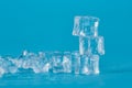 Ice cubes on a blue background on top of each other Royalty Free Stock Photo