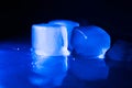 Ice cubes in blue light Royalty Free Stock Photo