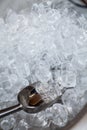 ice cubes in a bucket. ice shovel. Ice scoop on the ice cubes background, Top view with copy space and text Royalty Free Stock Photo