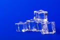 Ice cubes in close-up on blue background Royalty Free Stock Photo