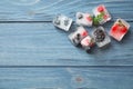 Ice cubes with different berries and mint on wooden table, flat lay. Space for text Royalty Free Stock Photo