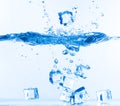 Ice Cubes Dropped into Water with Splash Royalty Free Stock Photo