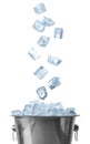 Ice cubes falling into bucket on background Royalty Free Stock Photo