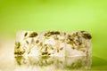 Ice cubes with flower bud on table Royalty Free Stock Photo