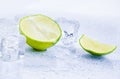 Ice cubes with fresh lime isolated on white Royalty Free Stock Photo