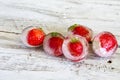 Ice cubes with strawberries Royalty Free Stock Photo