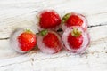 Ice cubes with strawberries Royalty Free Stock Photo