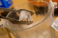 Ice cubes in a glass on a beige background, top view Royalty Free Stock Photo