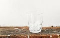 Ice cubes in a glass standing on a dirty table Royalty Free Stock Photo