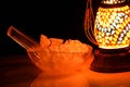 Ice cubes inside ice bowl along with colorful lamp