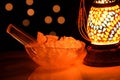 Ice cubes inside ice bowl along with colorful lamp