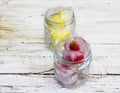 Ice cubes with lemons and strawberries Royalty Free Stock Photo