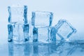 Ice cubes square with drops water clean on blue background Royalty Free Stock Photo