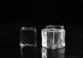 Ice cubes with water drops on black background, closeup Royalty Free Stock Photo