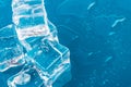 Ice cubes and water drops close up on blue background Royalty Free Stock Photo