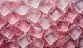 Ice cubes with water drops scattered on pink background, top view. Summer freshness concept
