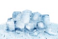 Ice cubes on white glass mirror background with reflection isolated close up, transparent frozen crushed blue ice cubes Royalty Free Stock Photo