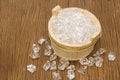 Ice cubes on wooden bucket Royalty Free Stock Photo