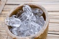 Ice cubes on wooden bucket Royalty Free Stock Photo