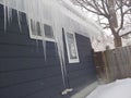 Ice dam on house in winter Royalty Free Stock Photo