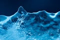 Ice on dark blue background. Frozen water, icicle abstract shapes. Macro view Royalty Free Stock Photo