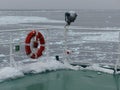 Ice on deck and floating brash ice in the ocean