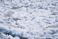 Ice drift on the Amur River. Melting ice floes in spring. A heap of blocks and fragments. Sunny day. Royalty Free Stock Photo