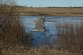 Ice drift, debacle. Old broken wooden bridge over the canal. Extreme crossing the river. Uncertainty concept