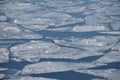 Ice drift on river in early spring on sunny day Royalty Free Stock Photo