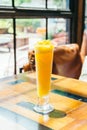 Ice drinking mango smoothie glass Royalty Free Stock Photo