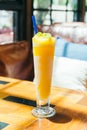 Ice drinking mango smoothie glass Royalty Free Stock Photo