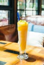 Ice drinking mango smoothie glass Royalty Free Stock Photo